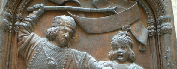 relief sculpture of man hitting child